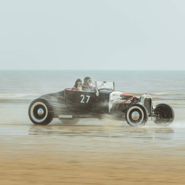 a car racing along Bridlington beach for Race the Waves