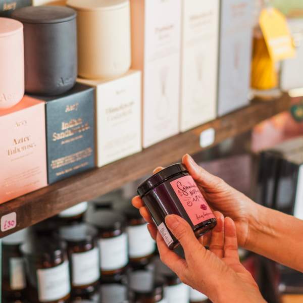 Woman looking at a jar in a shop in Howden
