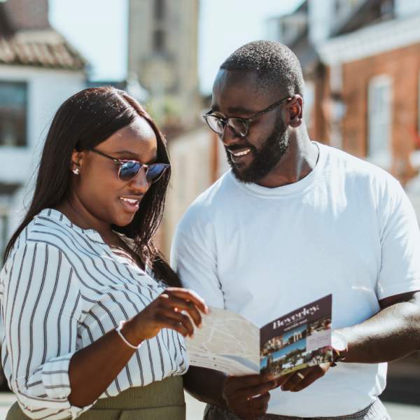 Couple looking over a Beverley map in Saturday Market