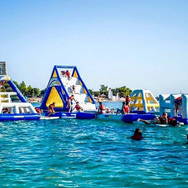 An inflatable assault course on a lake