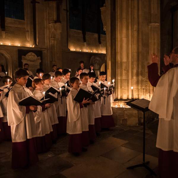 a choir of children singing in Chichester Cathedral