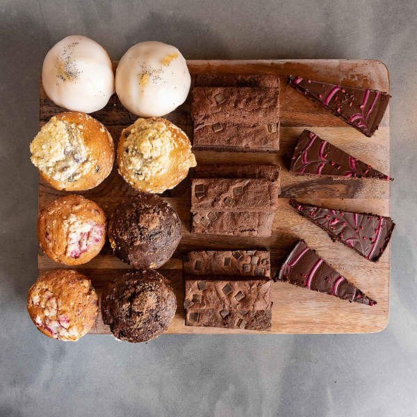 cakes and sweet treats on a board