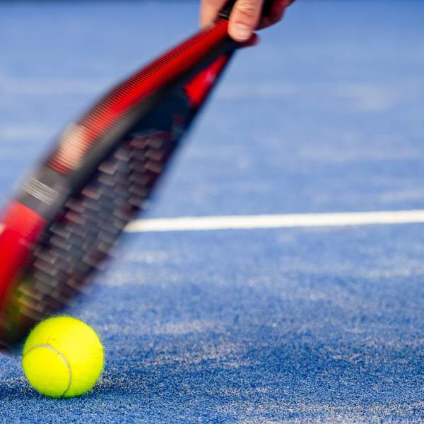 A padel racket and ball