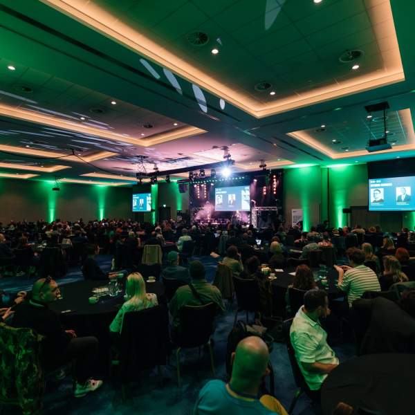 The ballroom at the Doubletree Hull illuminated in green and full of delegates