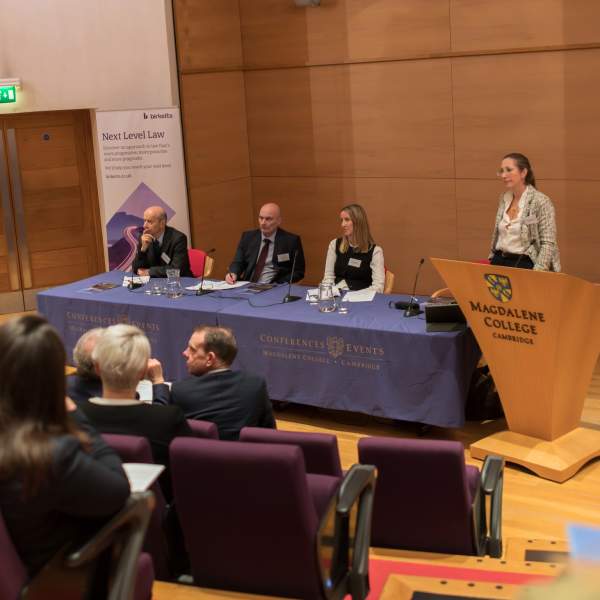 Speakers listening out to the audience at a high profile conference