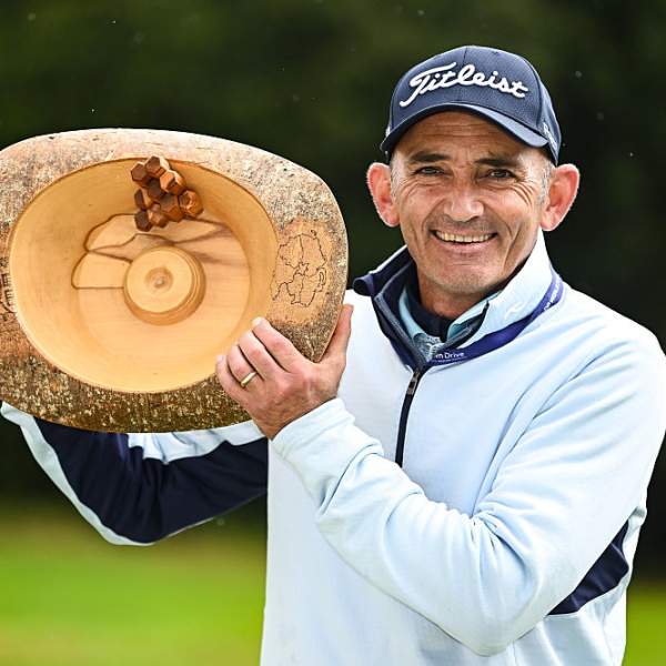 Image of Marcus Brier with NI Legends Open trophy.