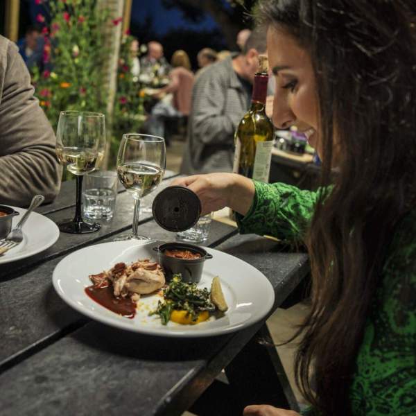 Couple enjoying a meal and a glass of wine at Slemish Supper Club, Ballymena
