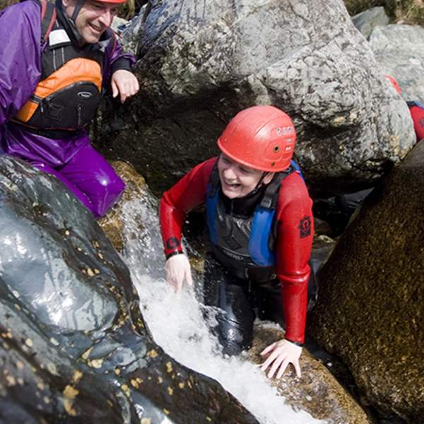 A young boy Bouldering at Bloody Bridge in Newcastle, County Down