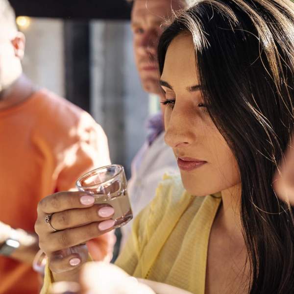 Group taste a cacao shot as part of the Master Craft Chocolate Experience
