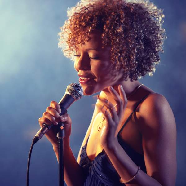 Black female Singer Performing on stage