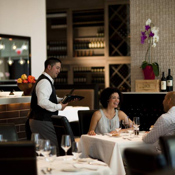 A couple dining at La Luce at Hilton Orlando Bonnet Creek