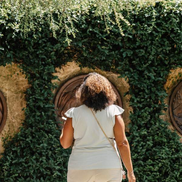 A woman views outdoor sculpture at the Albin Polasek Museum & Sculpture Gardens.