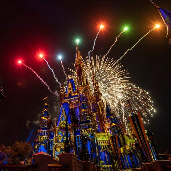 Colorful fireworks light up the sky over Cinderella Castle at Magic Kingdom Park