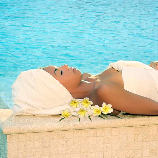 Serenity Spa by Westgate at Westgate Lakes Resort & Spa lady laying by the pool