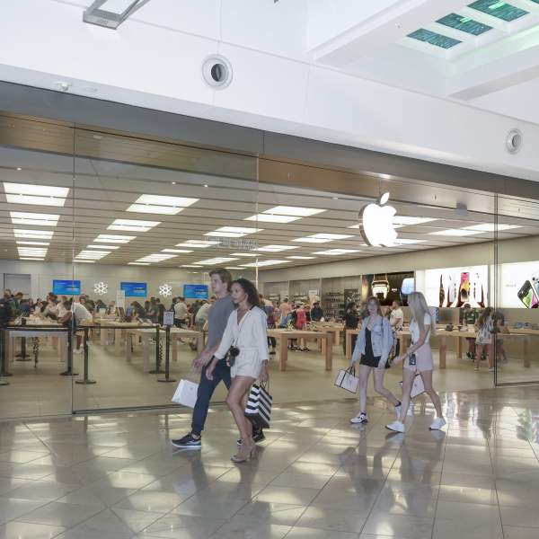 People walking by Apple Store at the Mall at Millenia