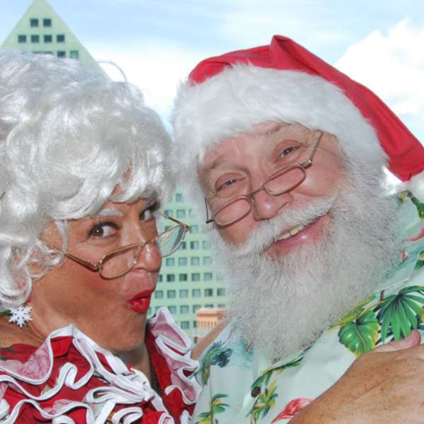 Santa and Mrs. Clause in front of the Walt Disney World Swan and Dolphin Resort