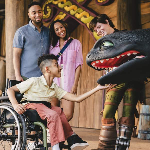 Family at Epic Toothless meet and greet in wheelchair, How to Train Your Dragon