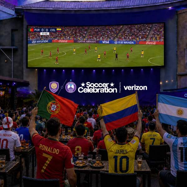 Renderings of viewing areas, Outdoor watch party with guests seated at tables watching a soccer match on a large screen, holding national flags including Portugal, Colombia, and Argentina. The scene is set in a plaza with purple stage lighting and branded Soccer Celebration signage.