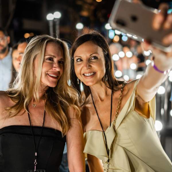 Women taking a selfie at Immerse 2025