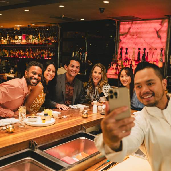 Four-time James Beard Award nominee Chef Henry Moso takes a selfie with guests at Kabooki Sushi on Sand Lake Road in Orlando.