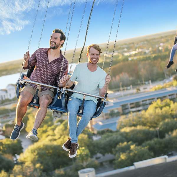 A gay couple riding the Orlando Starflyer at ICON Park