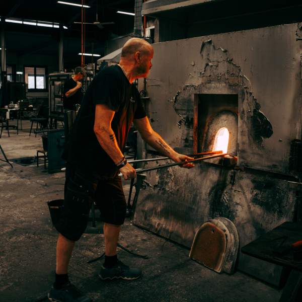 Glassblower in action at Magnor Glassverk