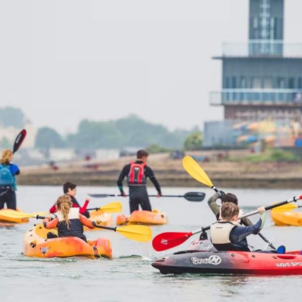 Photograph of people kayaking on the water at Andrew Simpson Centre Portsmouth