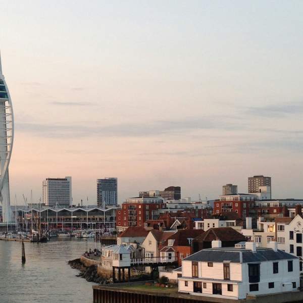 Pink-hued skies behind the Spinnaker Tower and Old Portsmouth