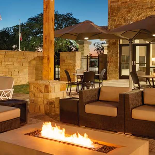 Luxury outdoor hotel patio with fireplace