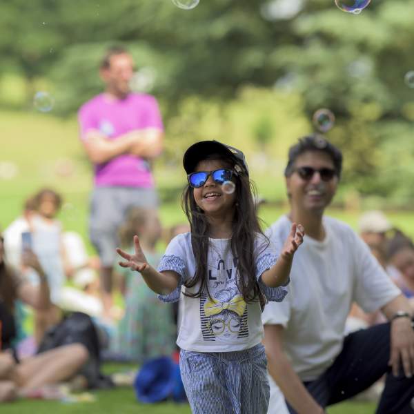 Children and adults enjoying the summer at Compton Verney
