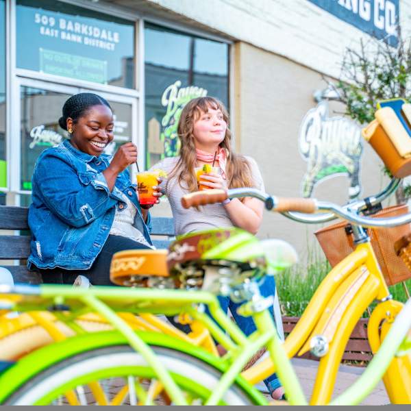 Two Women on Bench in East Bank District