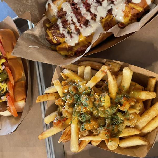 A photo of fries and two hot dogs from The Missing Link