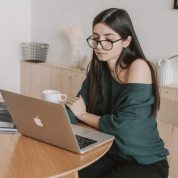 woman using laptop at table