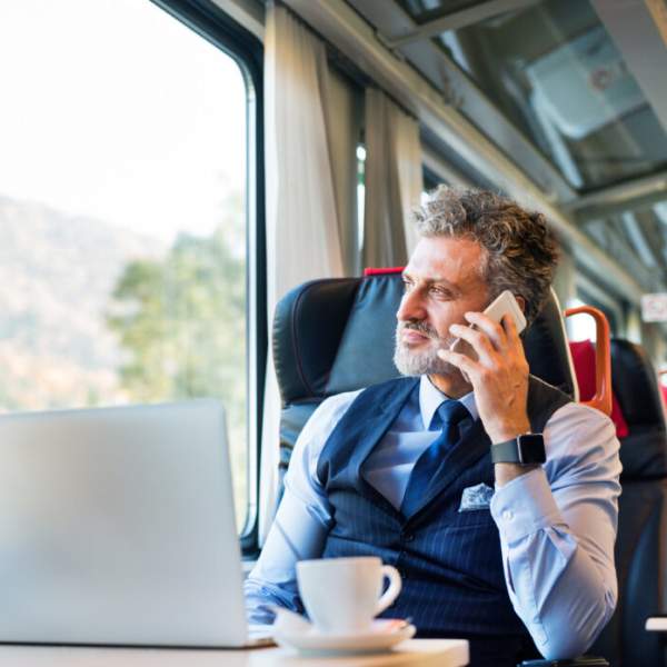 Man using phone on train
