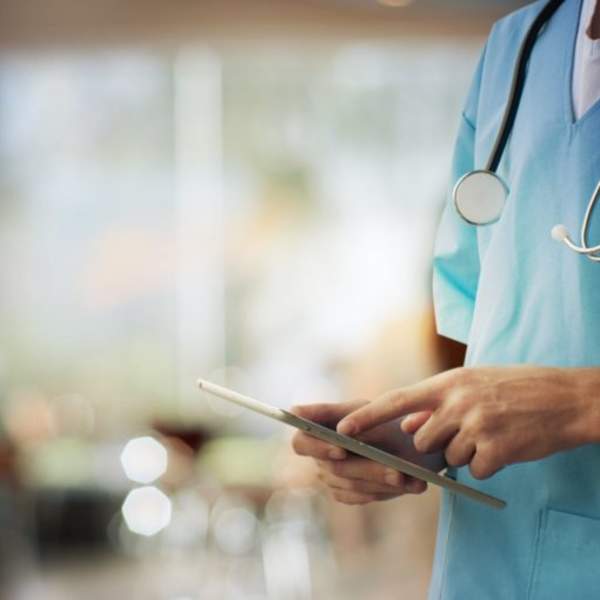 medical staff using tablet