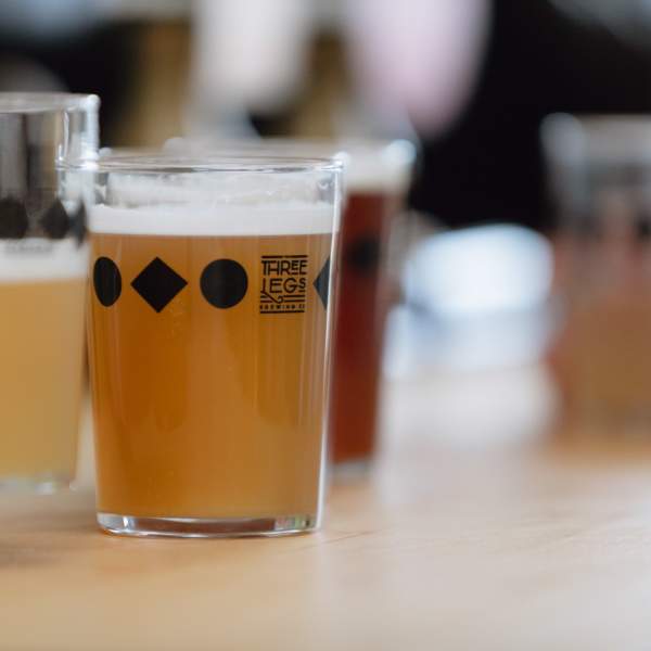 Two pints of craft beer on the bar at Three Legs Brewery, Sussex