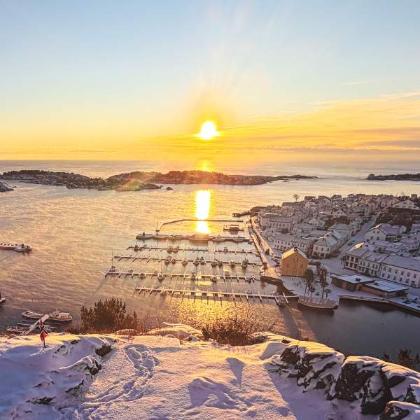View of Risør town and the sea on a winter day at sunrise