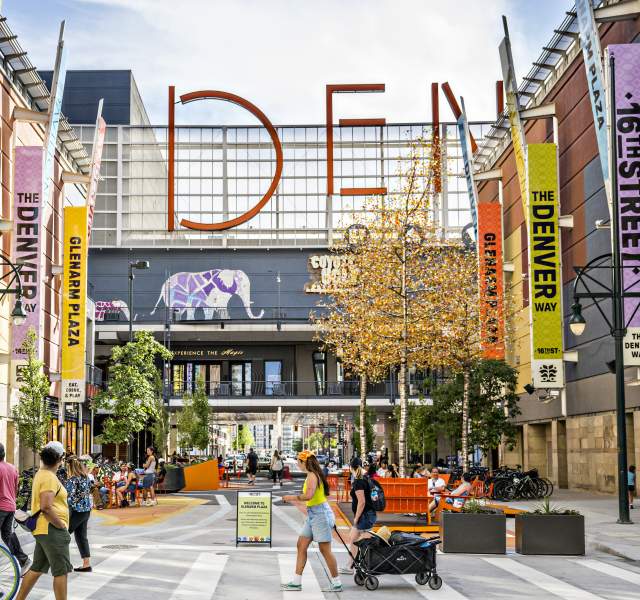 People walking outside the Denver Pavilions on the 16th Street pedestrian promenade.