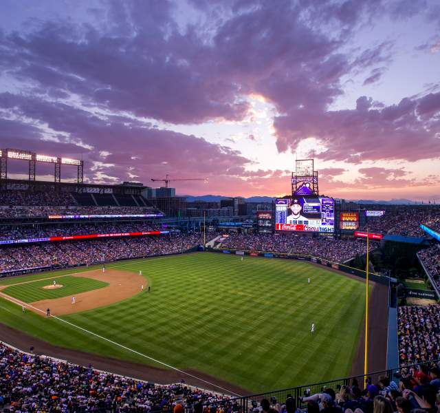 Coors Field glows at sunset in Denver, Colorado