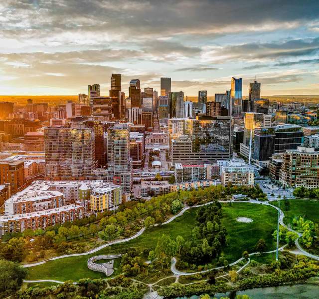 An aerial view of the Denver, Colorado, skyline during sunrise.