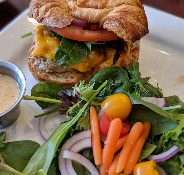 Croissant sandwich and salad at Blue Moon Cafe