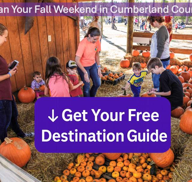 Families with children pick pumpkins at a pumpkin patch in Cumberland County, North Carolina. A bold purple call-to-action button reads ‘↓ Get Your Free Destination Guide.’