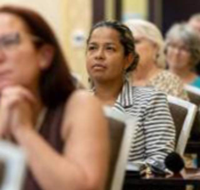 Image of people attending a meeting at the Embassy Suites Fayetteville