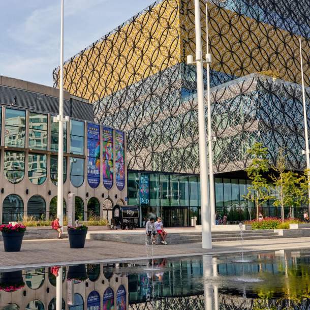 Outside of Birmingham Repertory Theatre; a glazed exterior with large lettering above saying 'the Rep'.