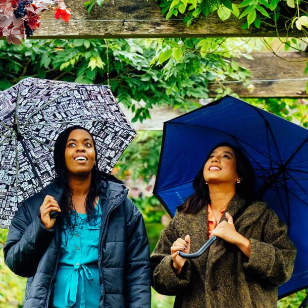 Two ladies with umbrellas