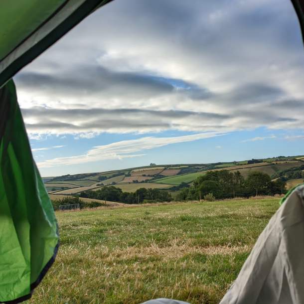 View of countryside through tent door
