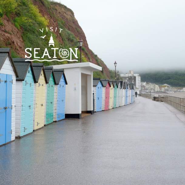 seaton beach huts in the rain