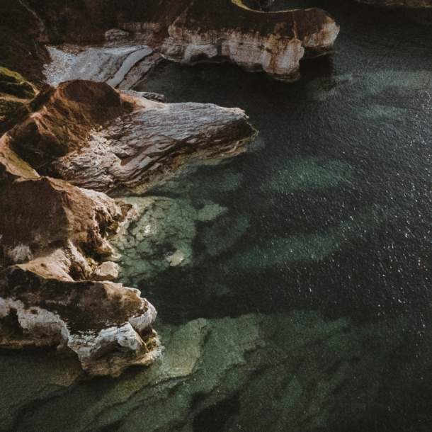 The cliff edge of Flamborough Head with clear seas.