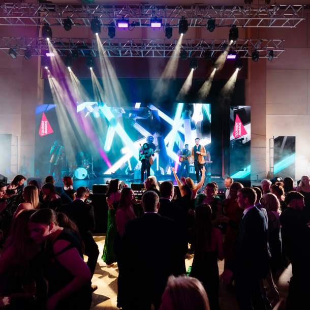 Entertainment on the stage at the REYTAs 2024 at Brid Spa with guests dancing on the dance floor