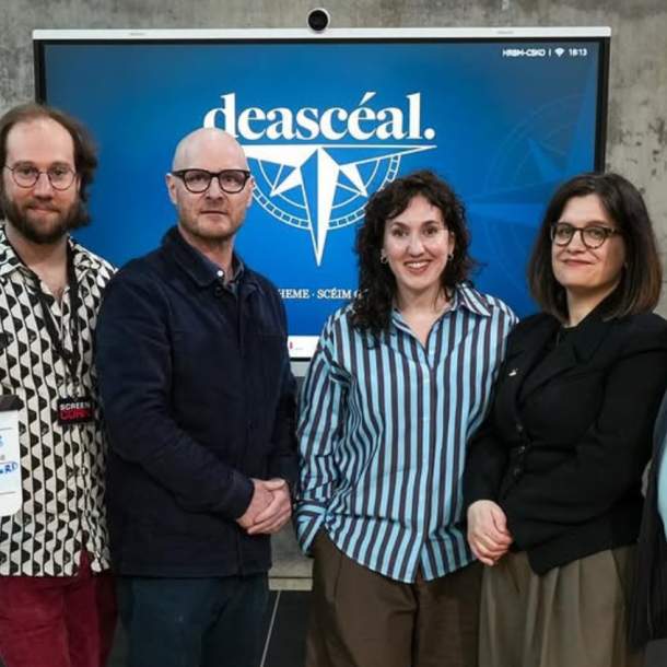 Representatives from Screen Kerry, Cork and Waterford, 4 men and 2 ladies photographed infront of a large screen with the Deasceal logo.